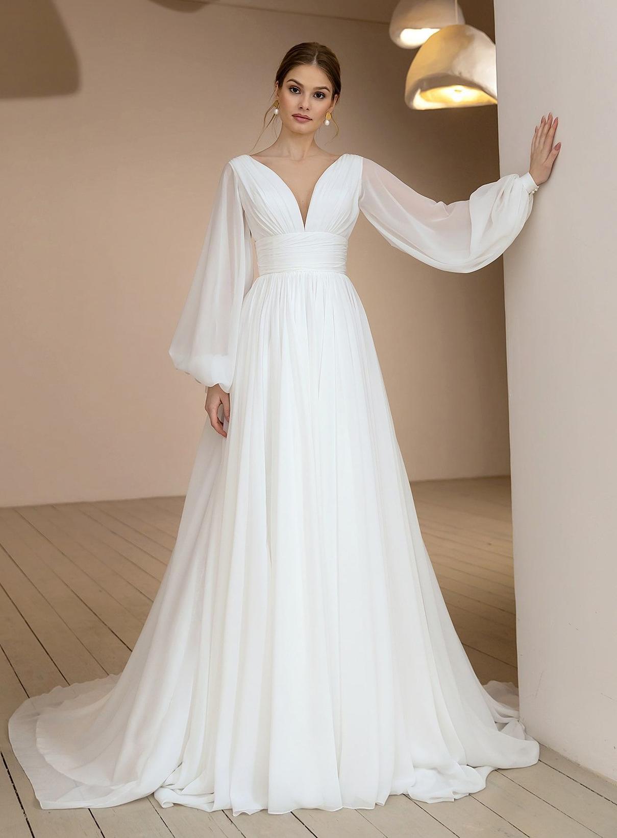 Воздушное свадебное платье с объемными рукавами фото